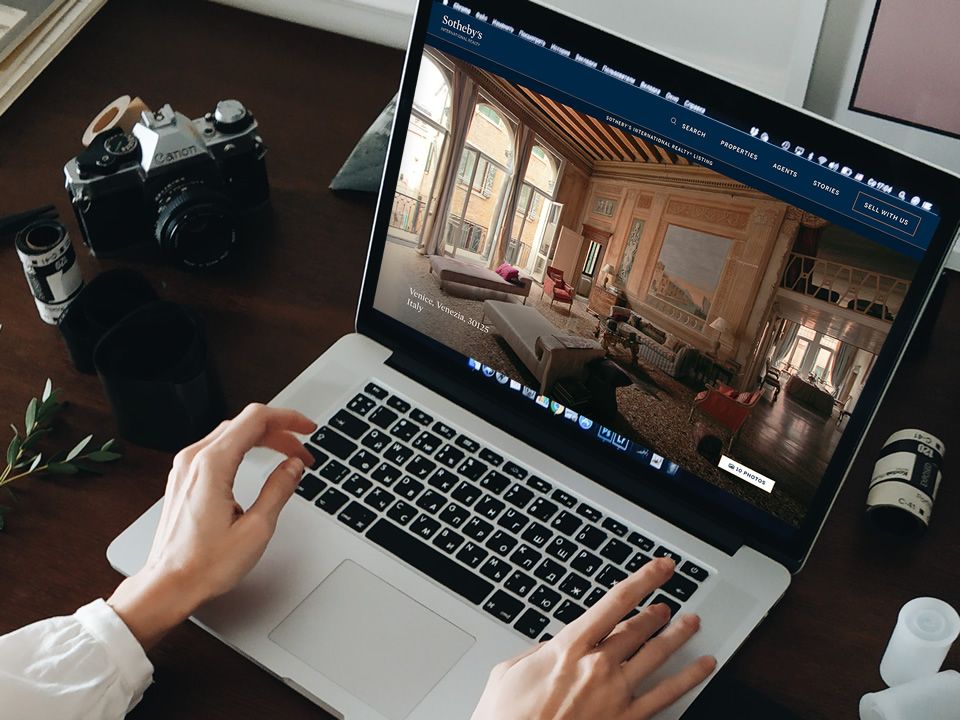 A laptop with the Venice Sothebys site on screen